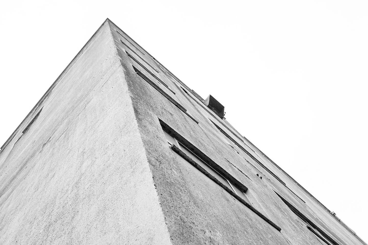 Low-angle black and white photograph of The Silo's concrete tower