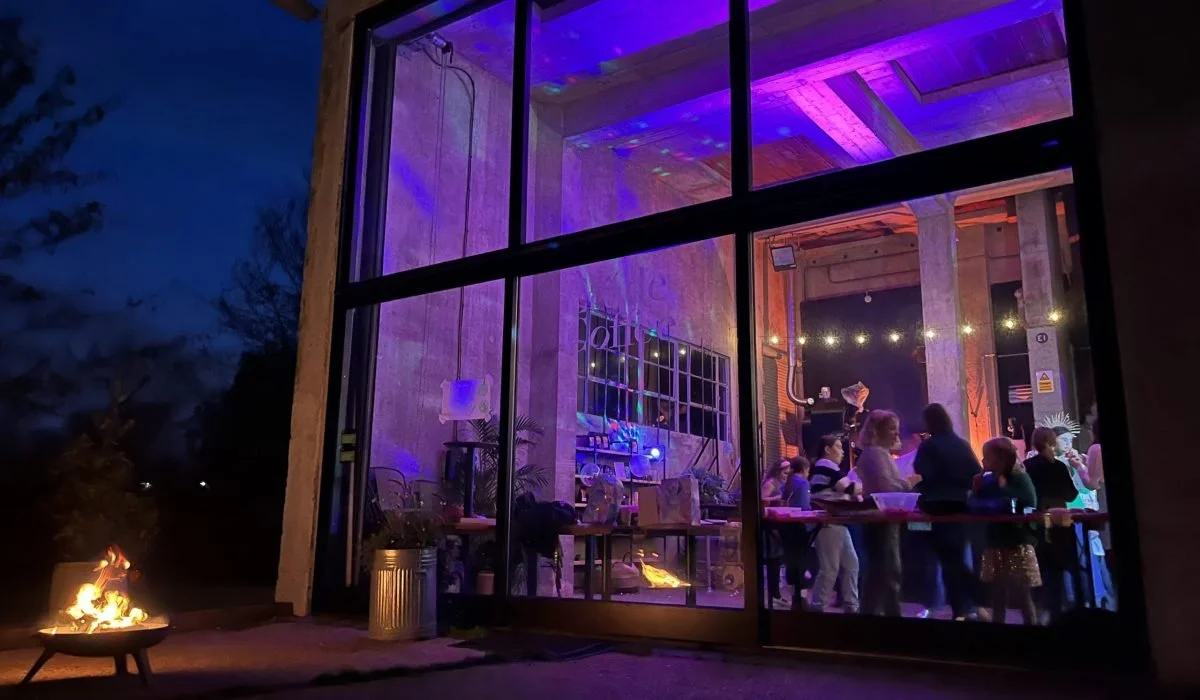 A private event inside The Silo, with string lights and a lively crowd